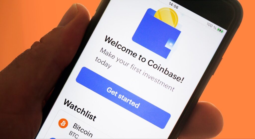 Hand holding smartphone with coinbase app