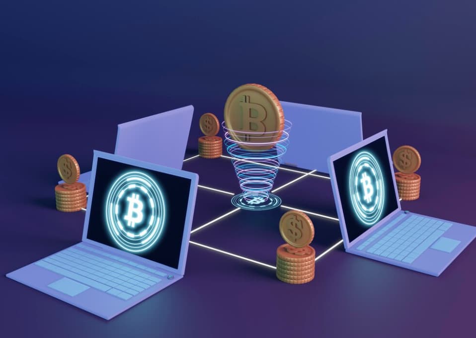 Laptops connected by glowing lines, symbolizing a cryptocurrency network